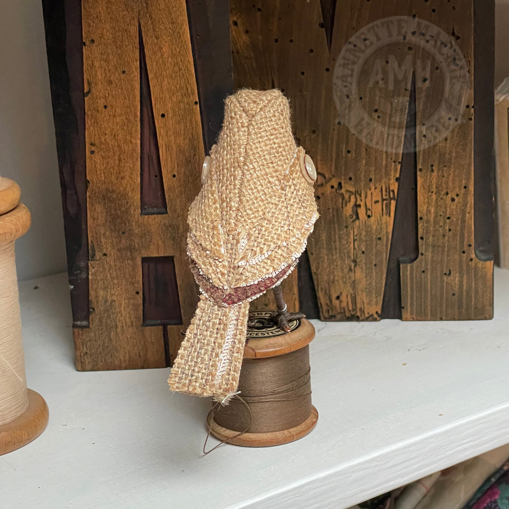 Hessian bird on vintage reel