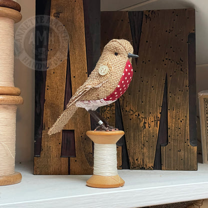 Hessian bird on vintage reel