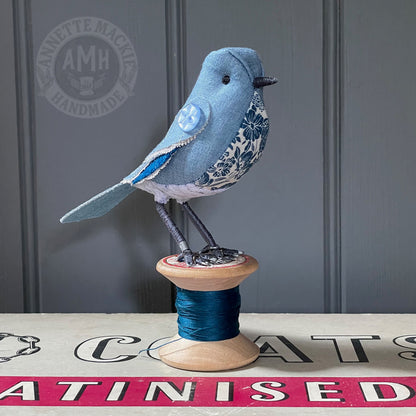 Standard bird on vintage reel