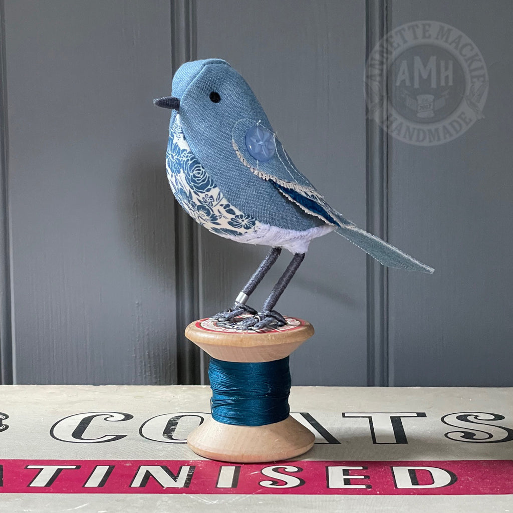 Standard bird on vintage reel