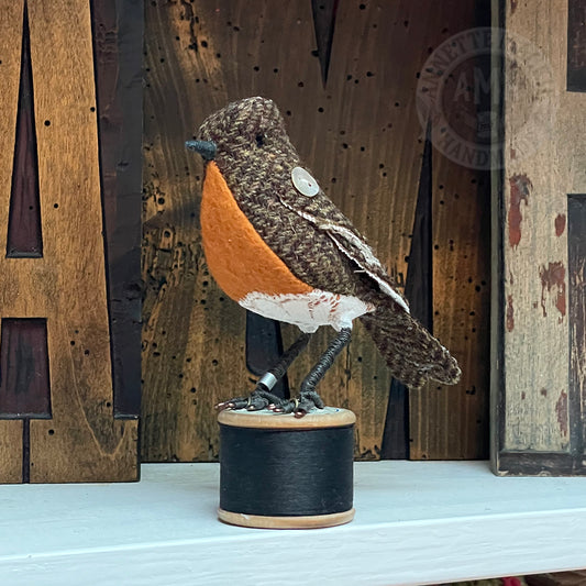 Mini robin on vintage reel