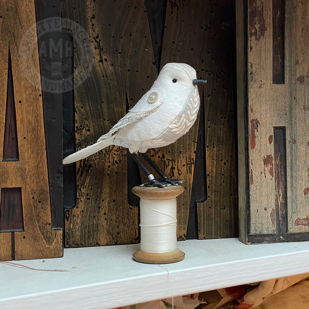 Standard bird on vintage reel