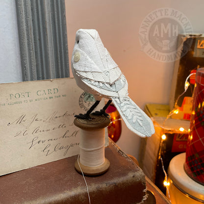 Standard bird on vintage reel