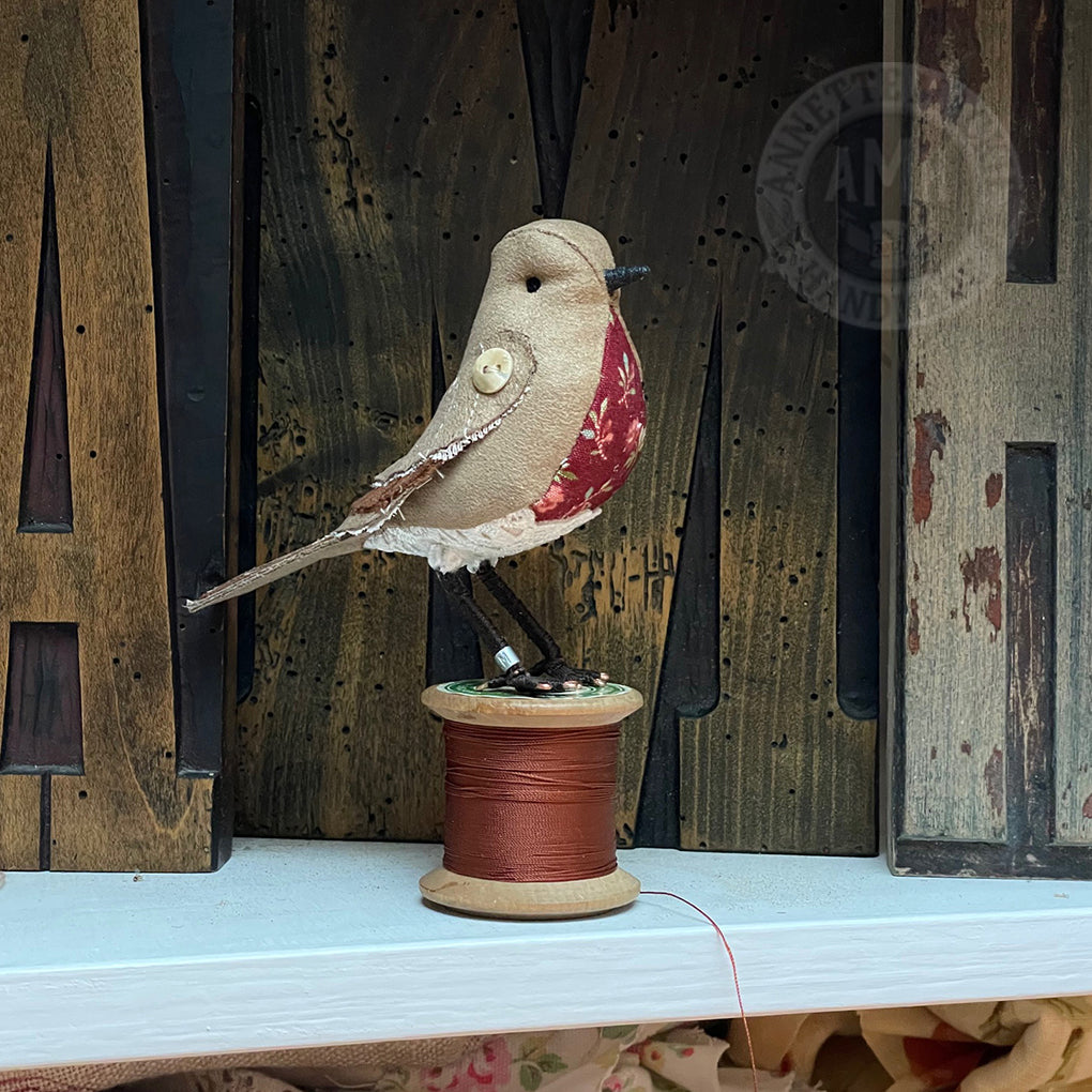 Standard bird on vintage reel